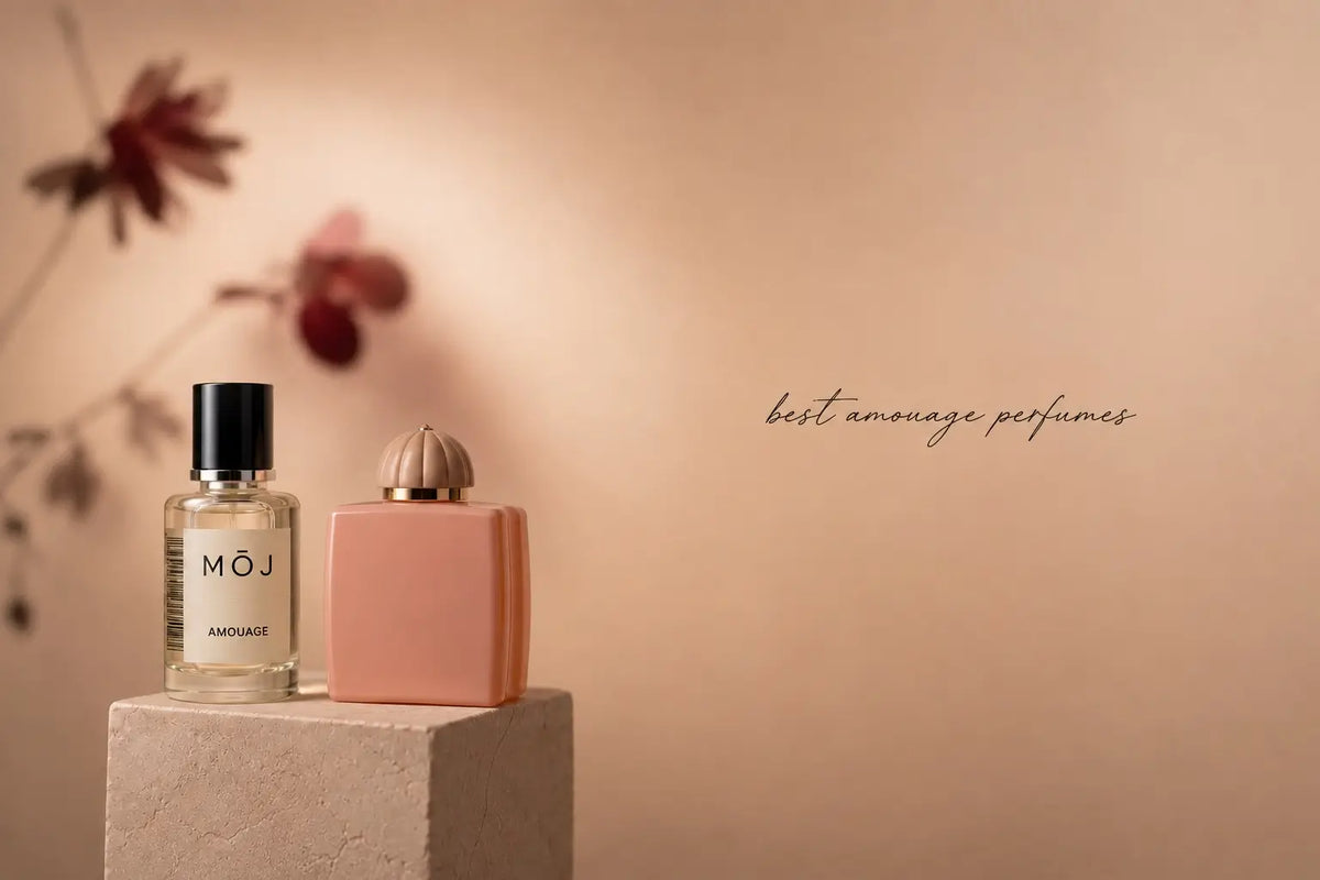 MOJ Amouage inspired perfume beside an Amouage bottle with its domed cap on a stone plinth