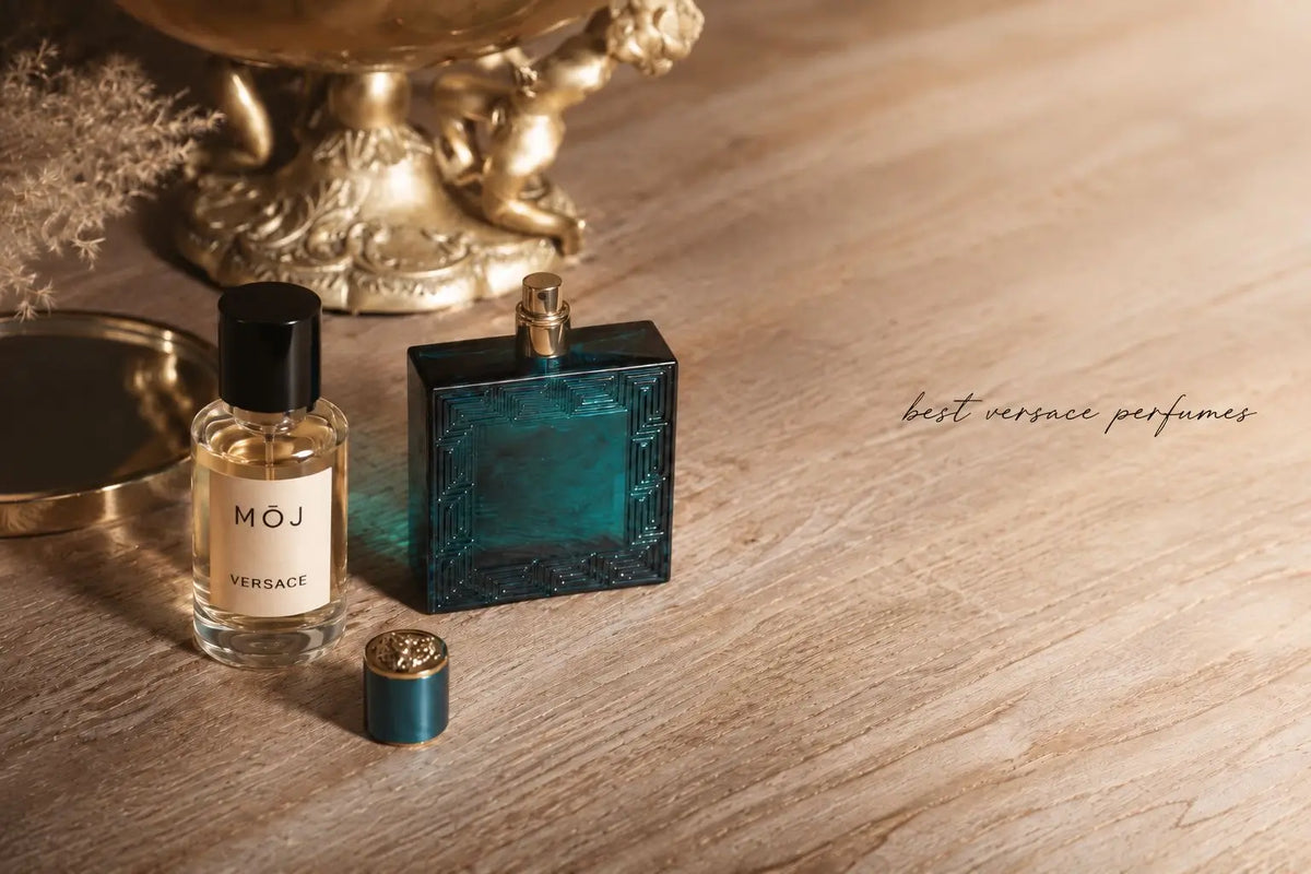 MOJ Versace inspired perfume bottle beside a turquoise Versace Eros bottle with its Medusa cap off on a wooden table