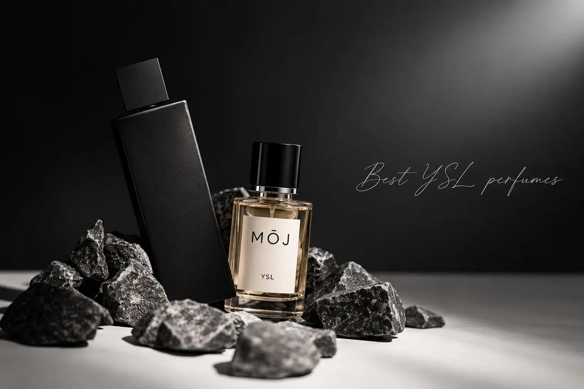 MOJ YSL inspired perfume beside a black Yves Saint Laurent bottle on dark stones